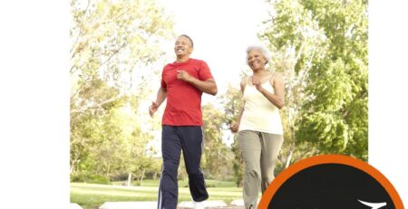 2 older people running in a park