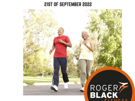 2 older people running in a park
