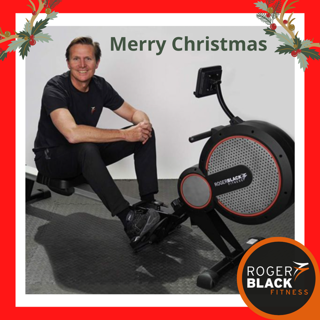 Roger Black on a rower with festive decorations